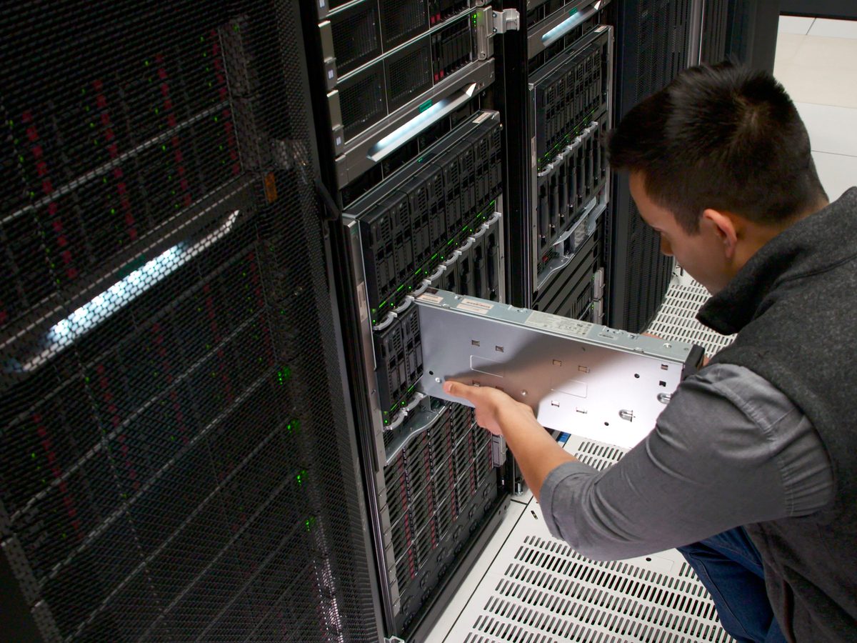 Man installing equipment in a server room